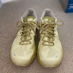 On Running Athletic Shoes in Yellow and Cream